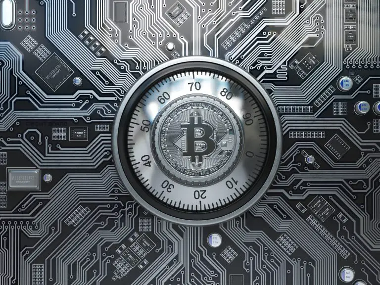 Bitcoin cryptocurrency security  and mining concept. Safe lock with symbol of bitcoin on circuit board.